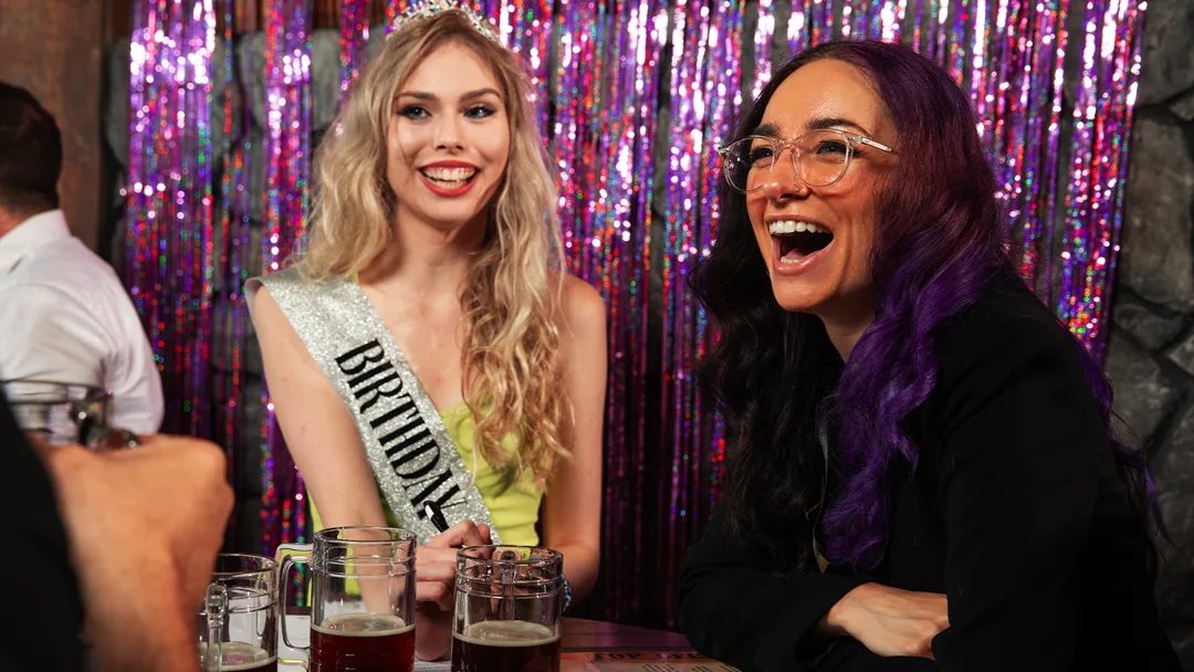 Guests celebrating at a Boston murder mystery party